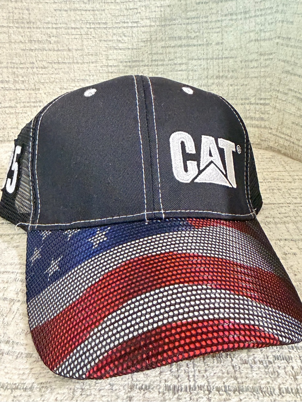 NWT! CAT Black Trucker Hat with American Flag Bill